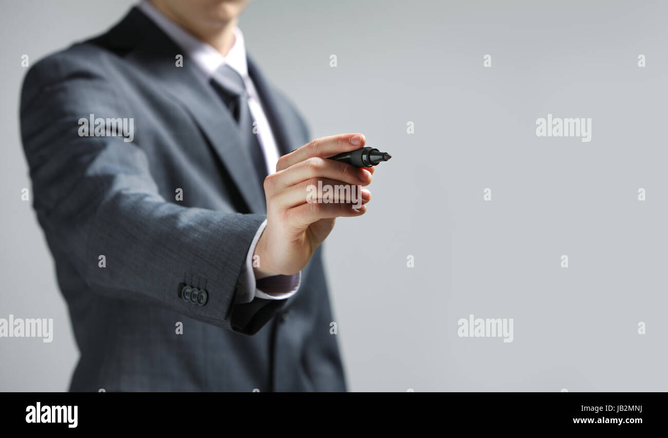 Businessman hand drawing in a whiteboard, copy space Stock Photo - Alamy