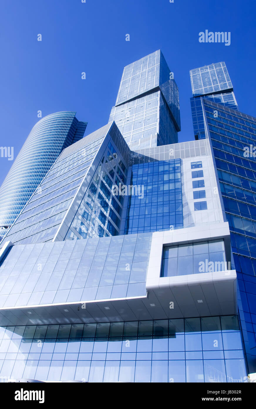 Modern skyscrapers under blue sky Stock Photo - Alamy