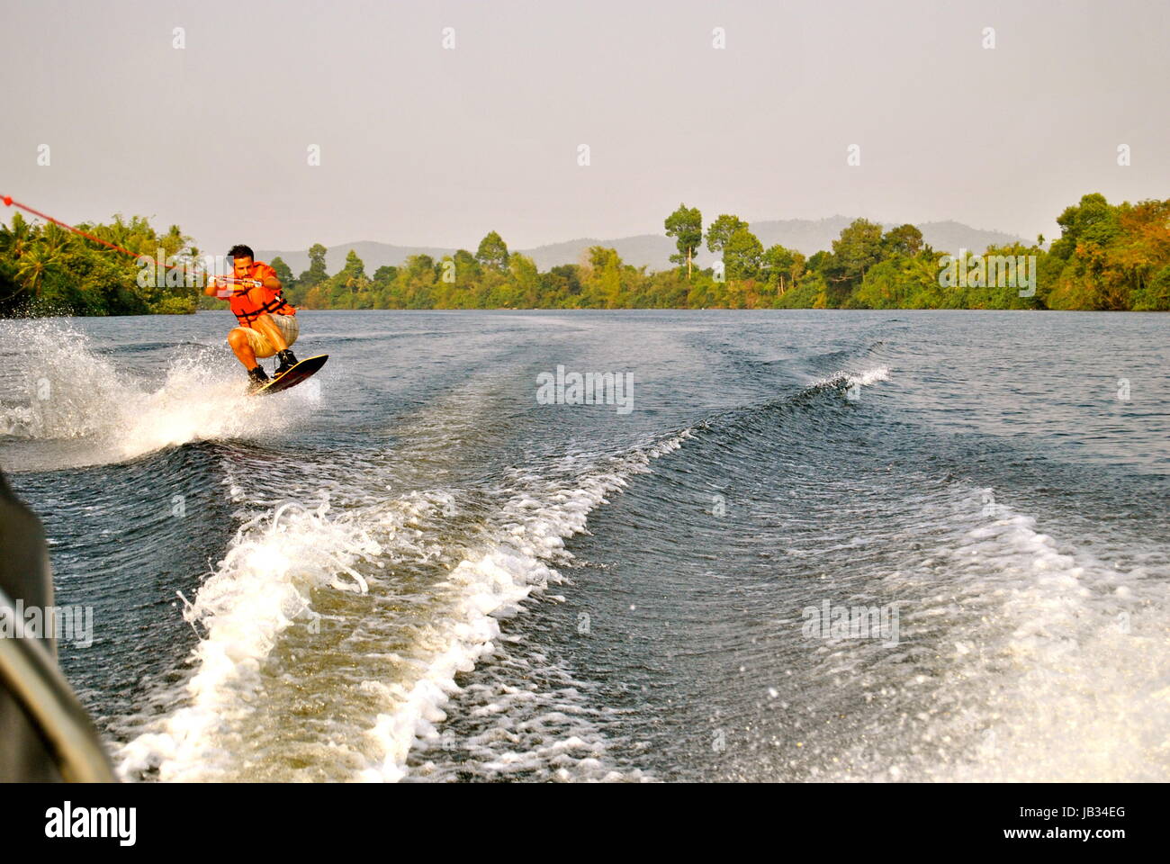 Man wakeboarding, Teuk Chhu, Kampot, Cambodia Stock Photo
