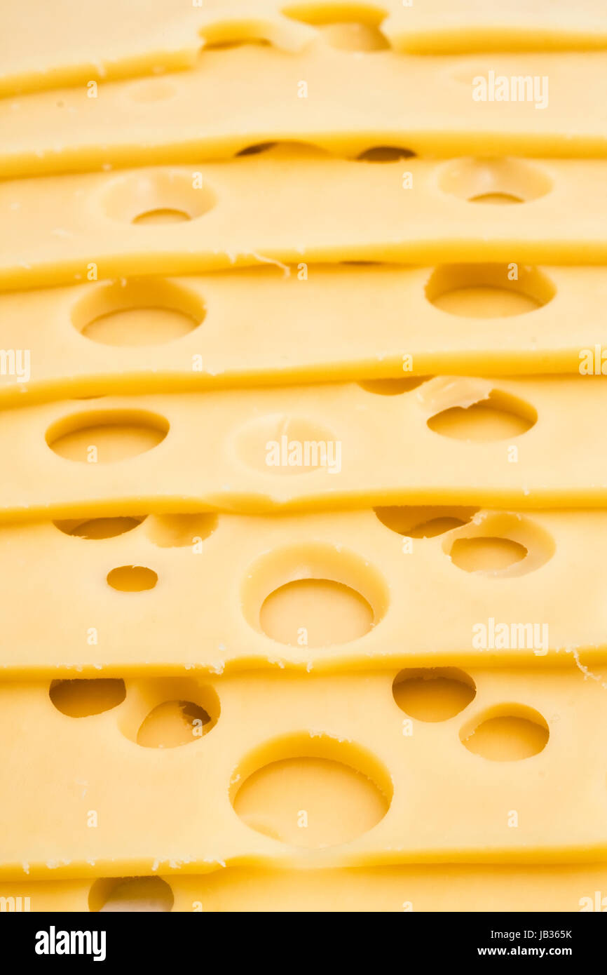 Sliced cheese with big holes Stock Photo Alamy