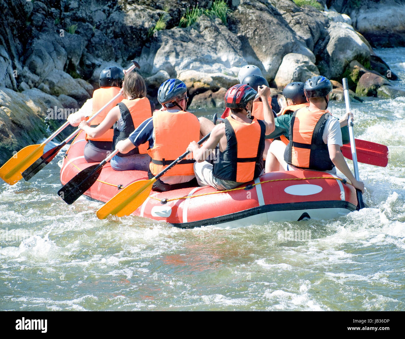Person Rowing A Raft group of people in a rafting boat, rowing on the river Stock Photo - Alamy