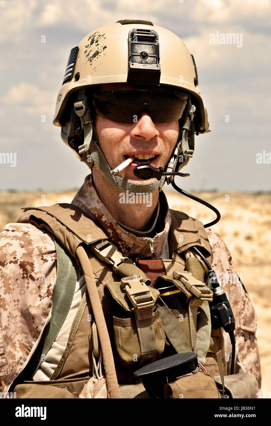 soldier smoking a cigarette smiling US soldier smoking a cigarette Stock Photo