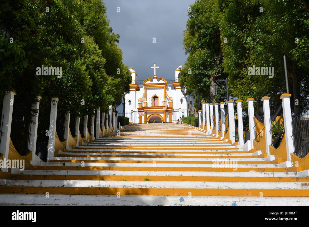 A Christian Catholic chapel on a hill with colorful steps in San Cristobal de las Casas, Chiapas, Mexico Stock Photo