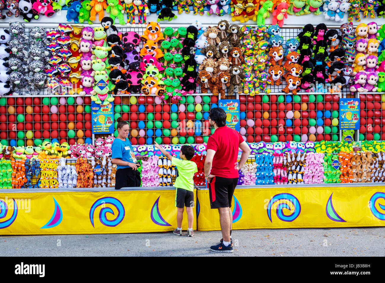 Miami Florida,Tamiami Park,Miami-Dade County Youth Fair & Exposition,county fair,carnival game,prizes,stuffed animals,toys,man men male,boy boys,kid k Stock Photo