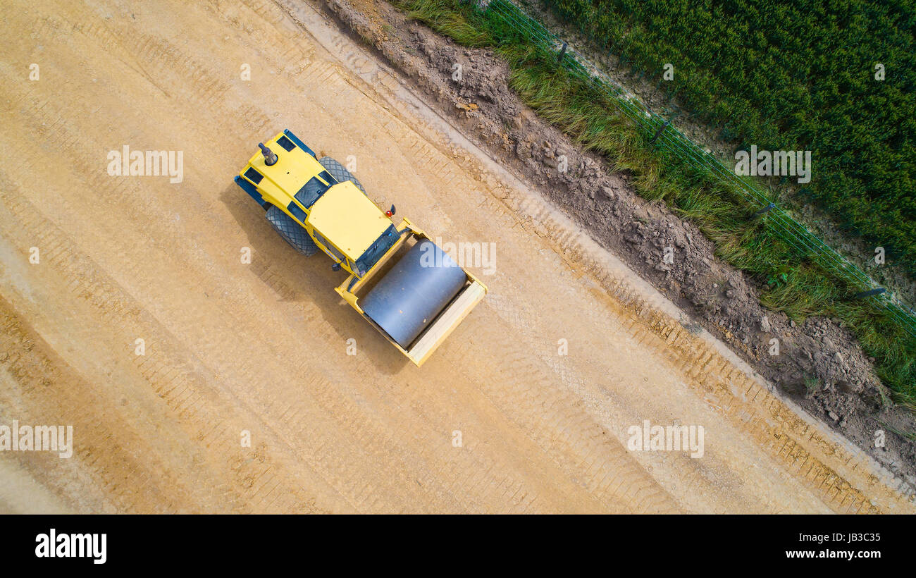 Aerial shot of steam roller on a roadwork near Vue, Loire Atlantique, France Stock Photo