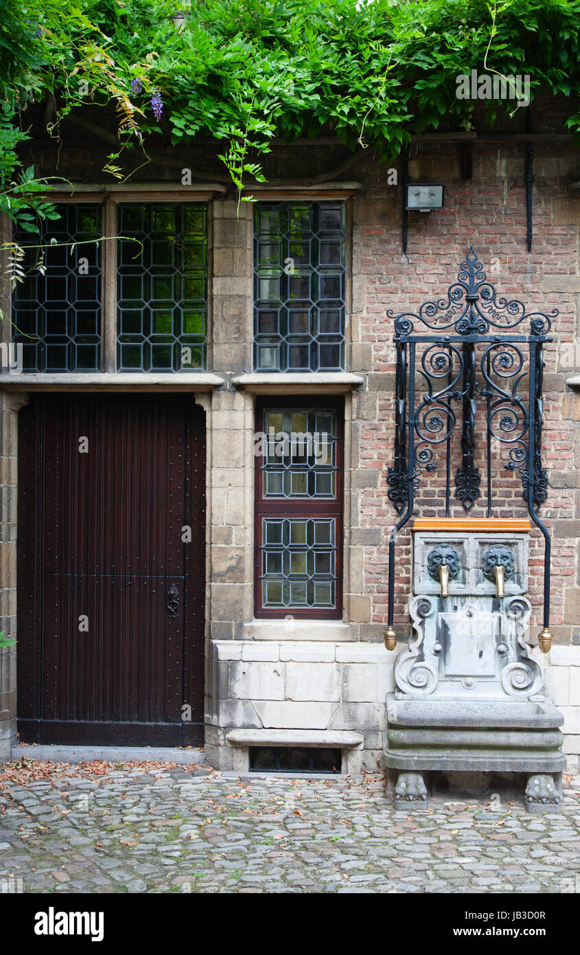 Water pump at the courtyard of the Rubenshouse, the former home and studio of Peter Paul Rubens in Antwerp, Belgium Stock Photo