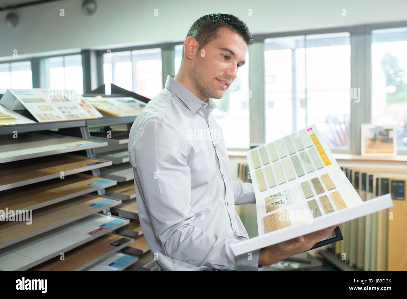 man choosing wood sample planning for home improvement Stock Photo