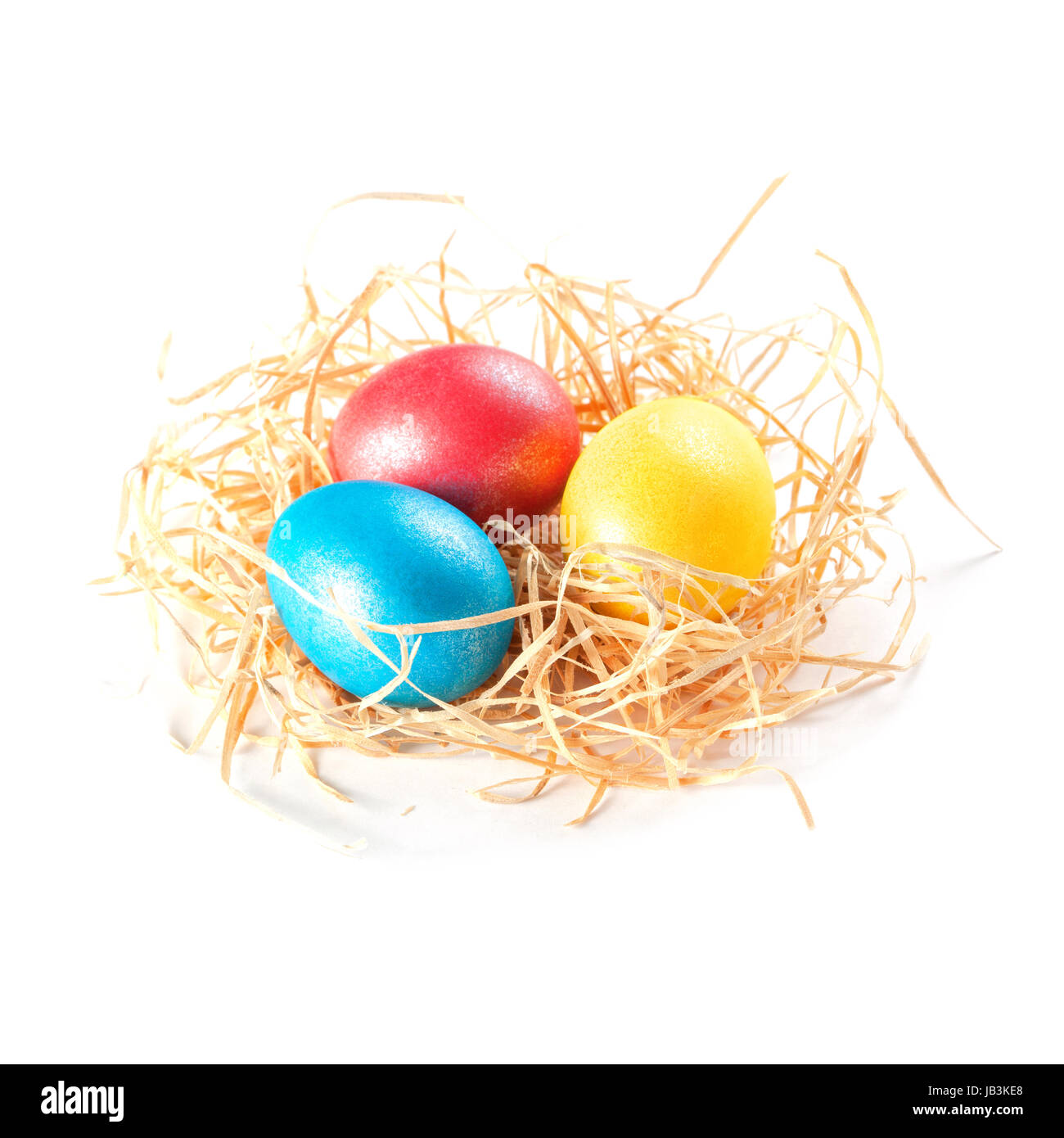 easter eggs in nest on white background Stock Photo - Alamy