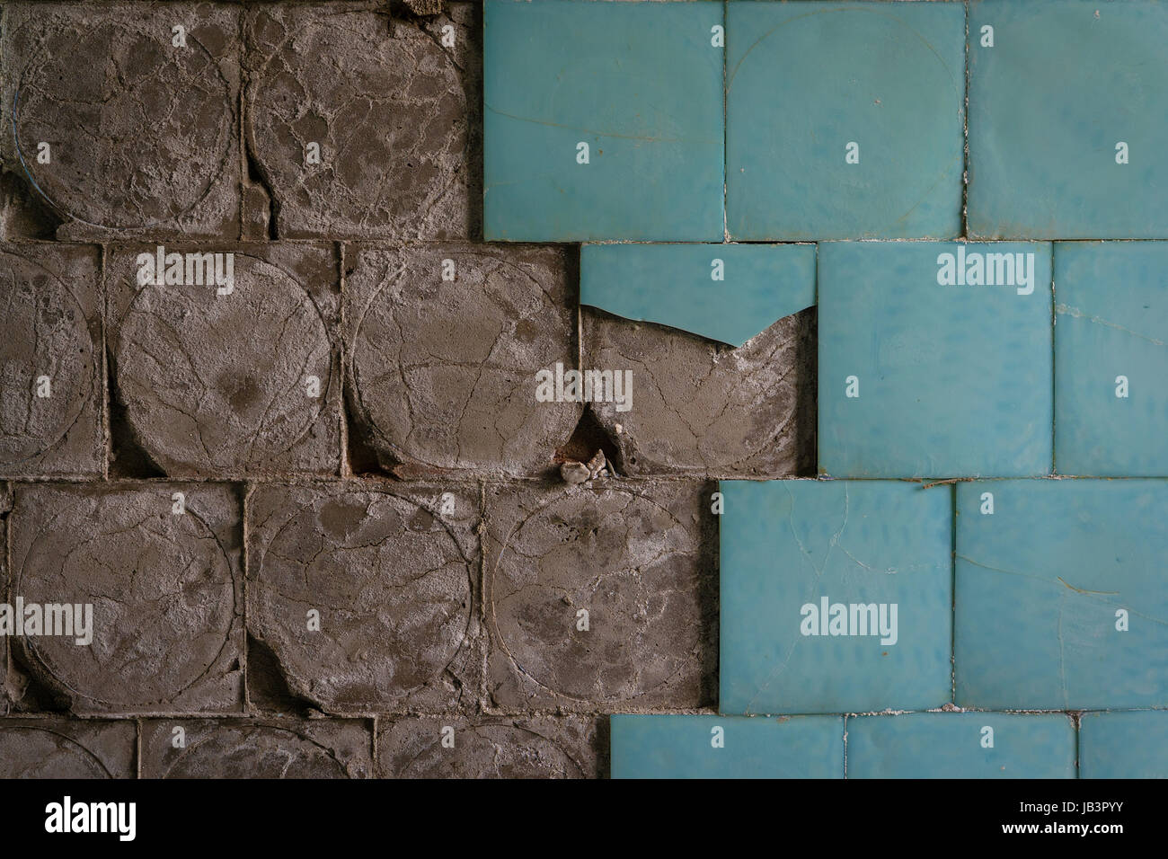 old ceramic floor tiles falling off from the wall Stock Photo Alamy