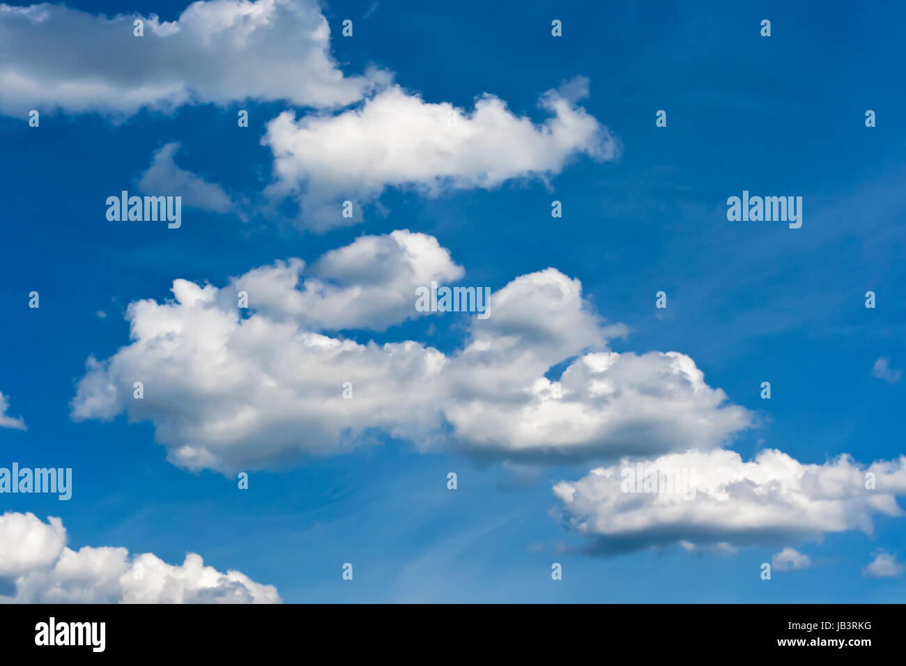 White clouds in blue summer sky background Stock Photo - Alamy