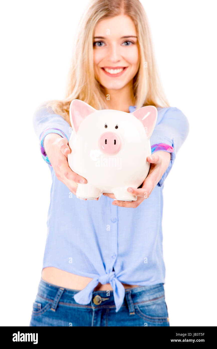 Beautiful and attractive blonde woman holding and showing a piggy bank ...
