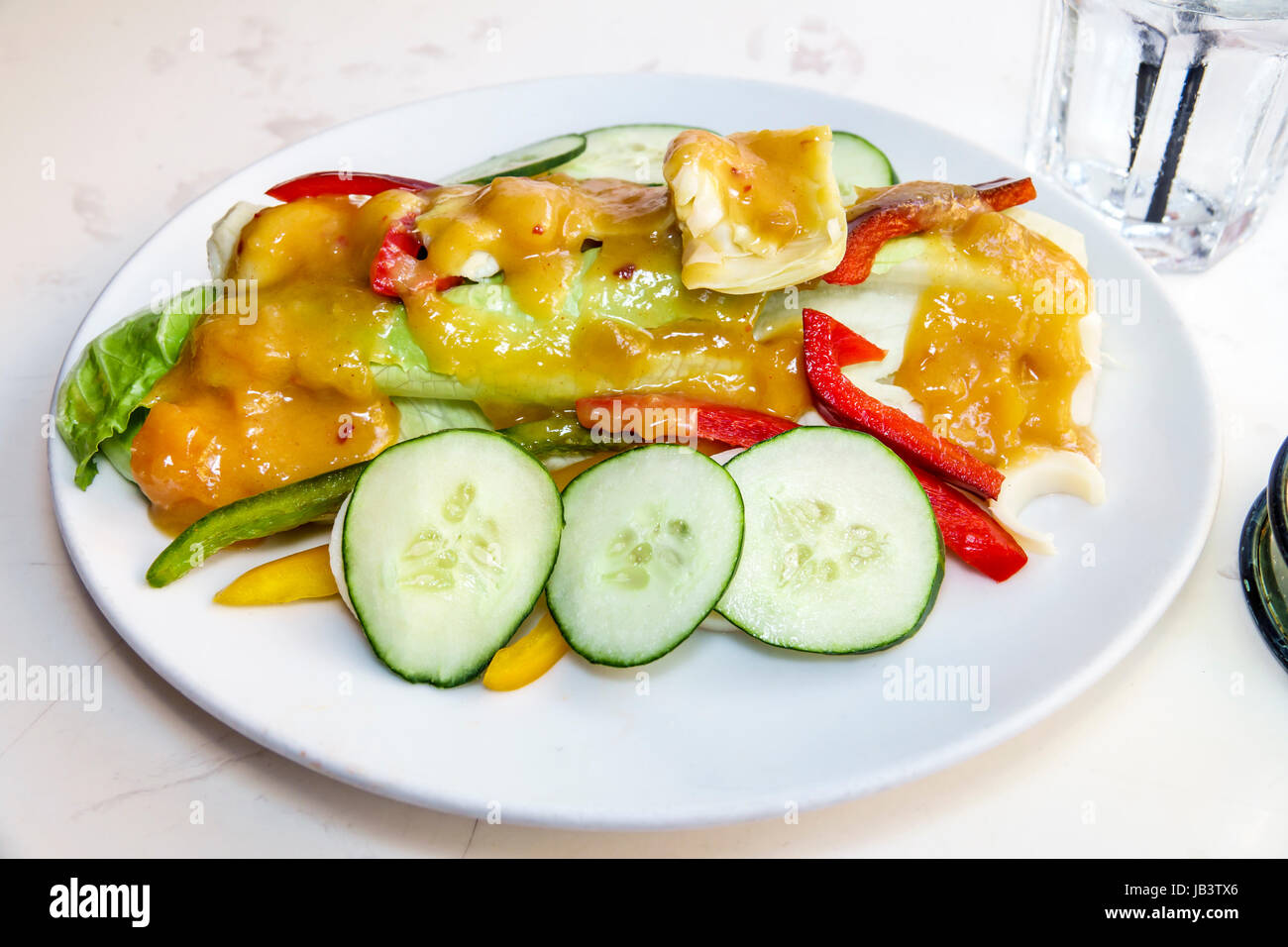 Miami Beach Florida,Front Porch Cafe,restaurant restaurants food dining cafe cafes,dining,salad,dressing,cucumber,food,plate,FL170401006 Stock Photo