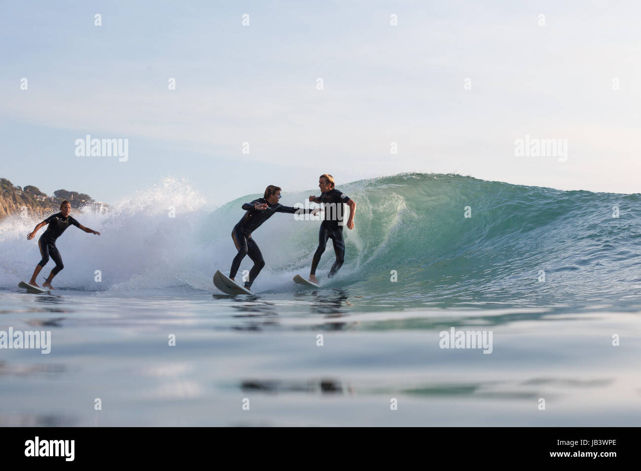 Overcrowded waves in Southern California lead two surfers to engage in a fistfight while surfing at Black's Beach. Stock Photo