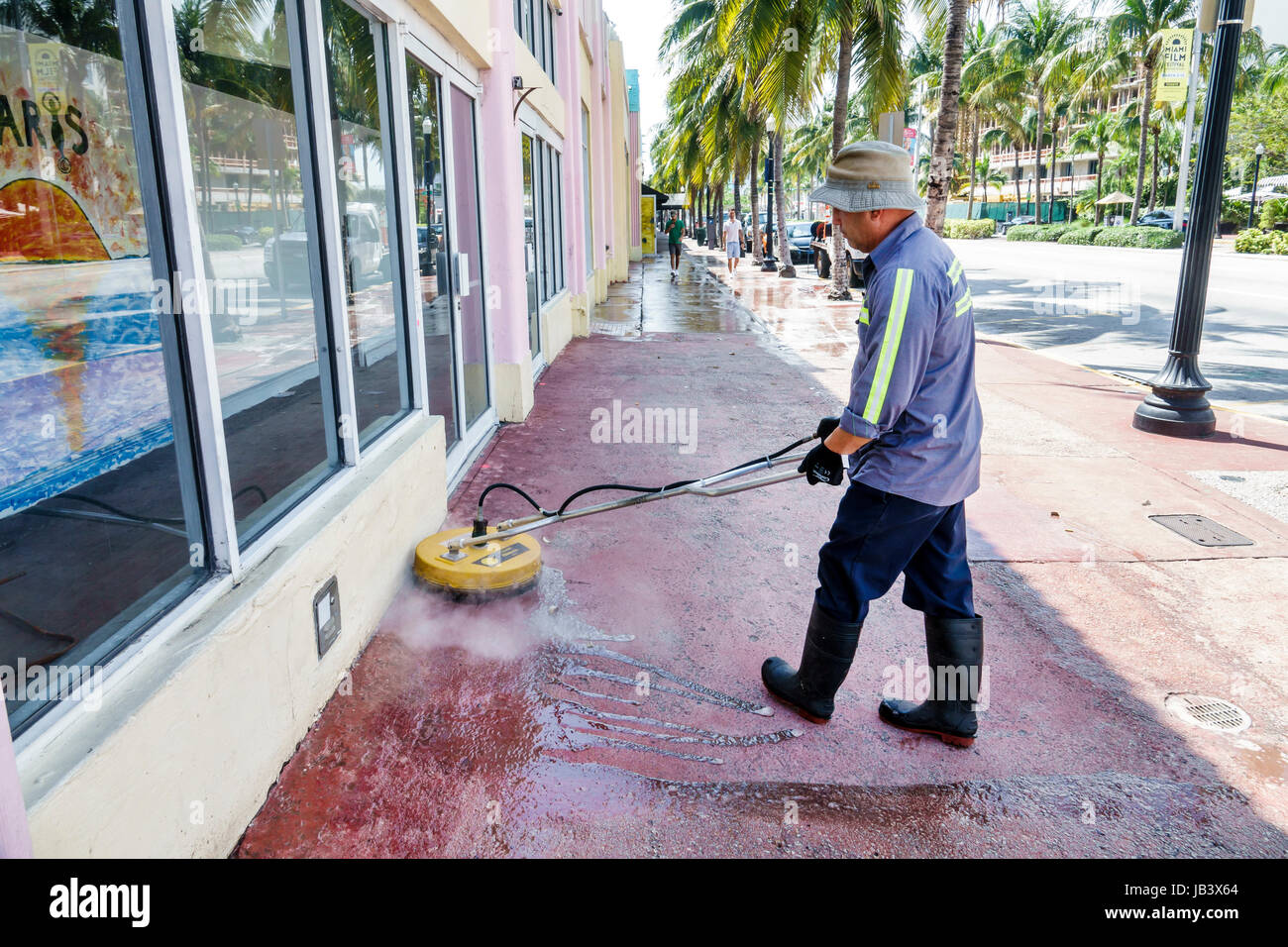 Miami Beach Florida,Washington Avenue,sidewalk,steam cleaning,Hispanic