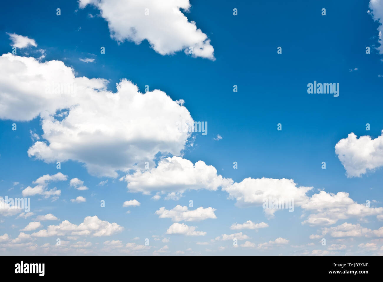 White clouds in blue summer sky background Stock Photo - Alamy