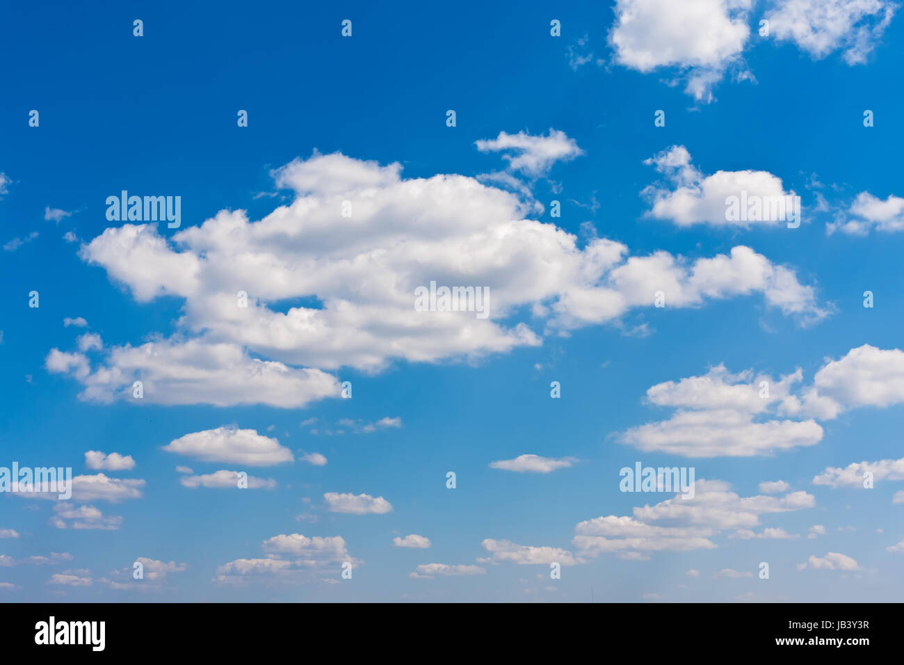 White clouds in blue summer sky background Stock Photo - Alamy