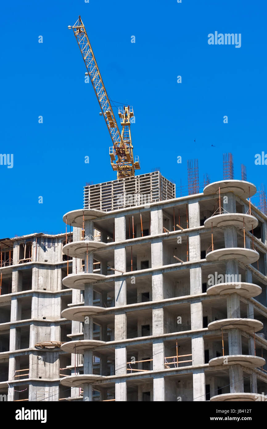 Construction of modern apartment building under blue sky Stock Photo ...