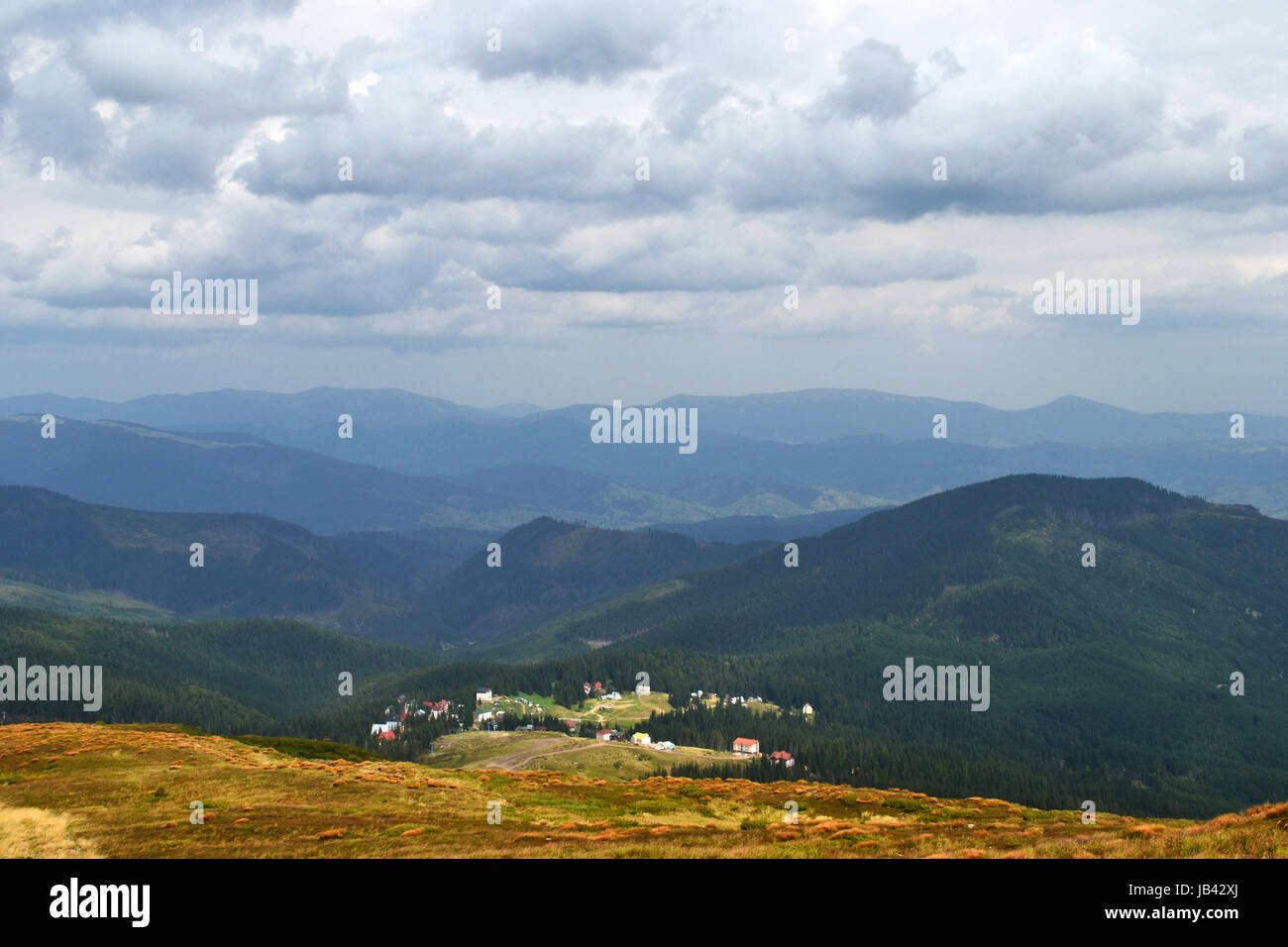 The village in a mountain valley Stock Photo - Alamy