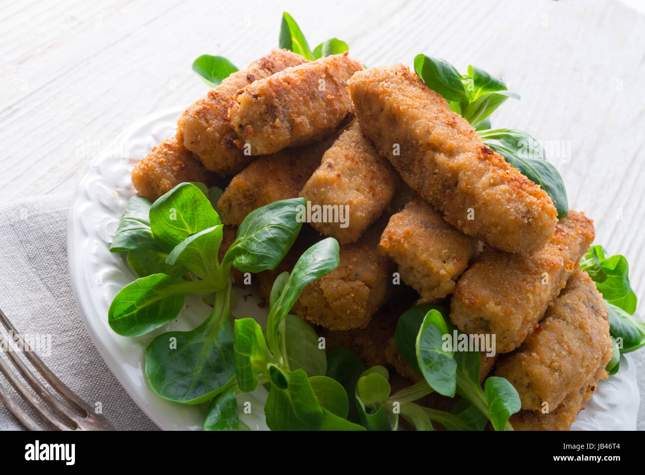 home-baked fish sticks with salad Stock Photo