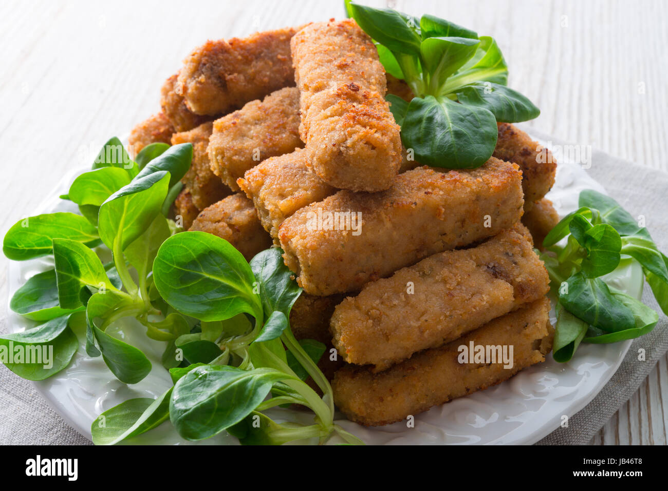 home-baked fish sticks with salad Stock Photo