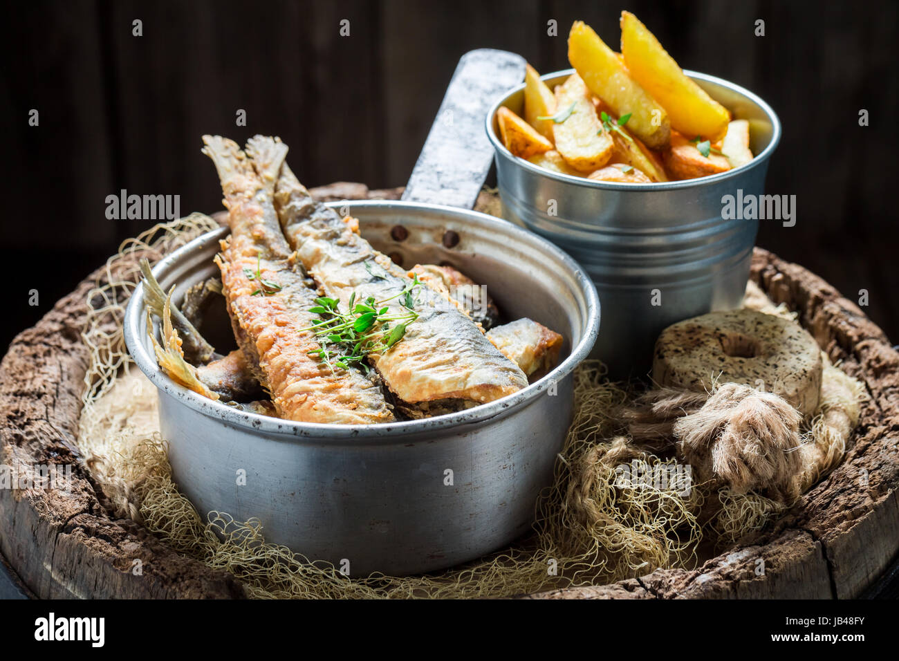 Delicious roasted herring fish with salt on old barrel Stock Photo Alamy