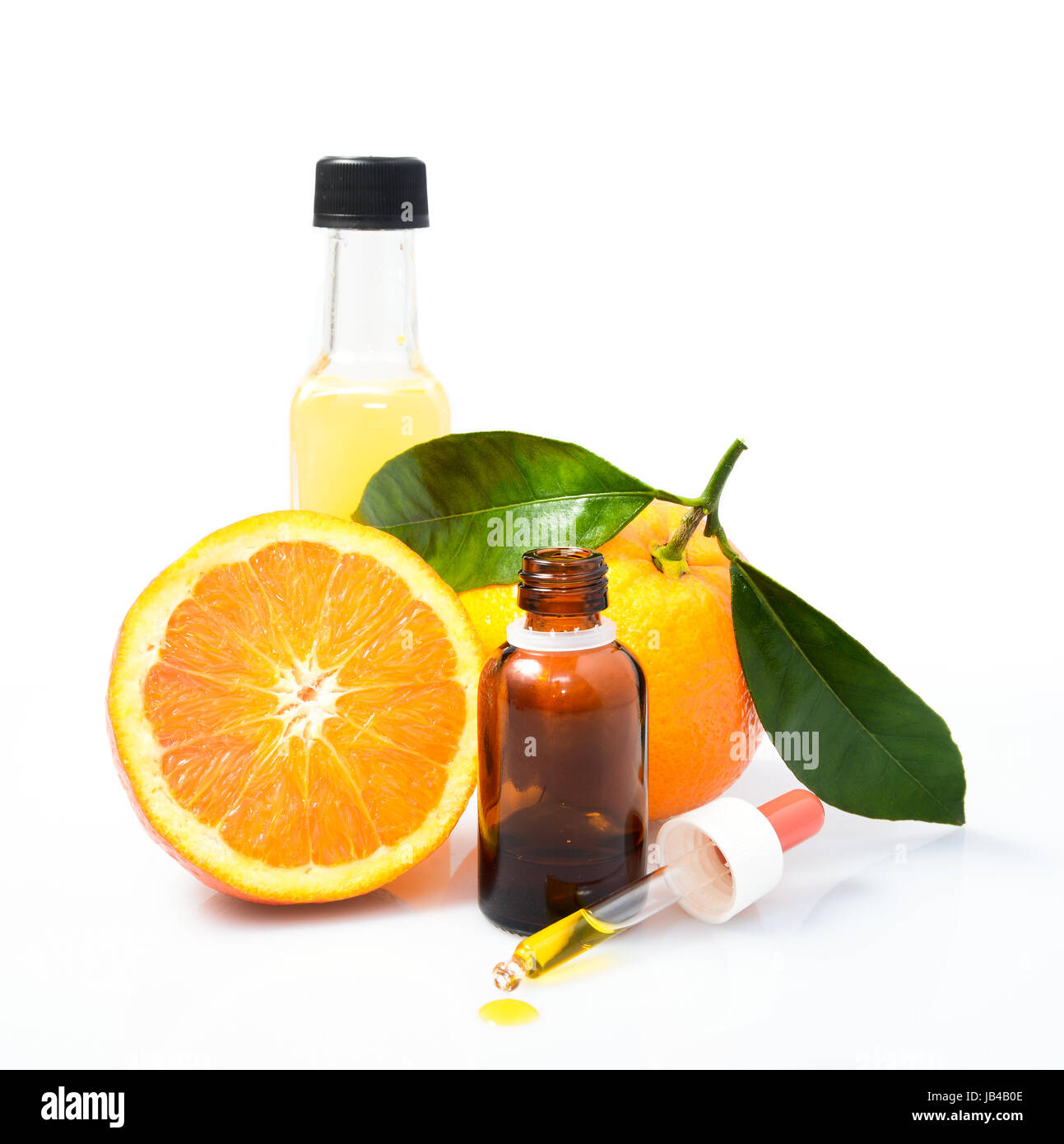 Dropper and bottle on the white background - medicine or science concept. Stock Photo