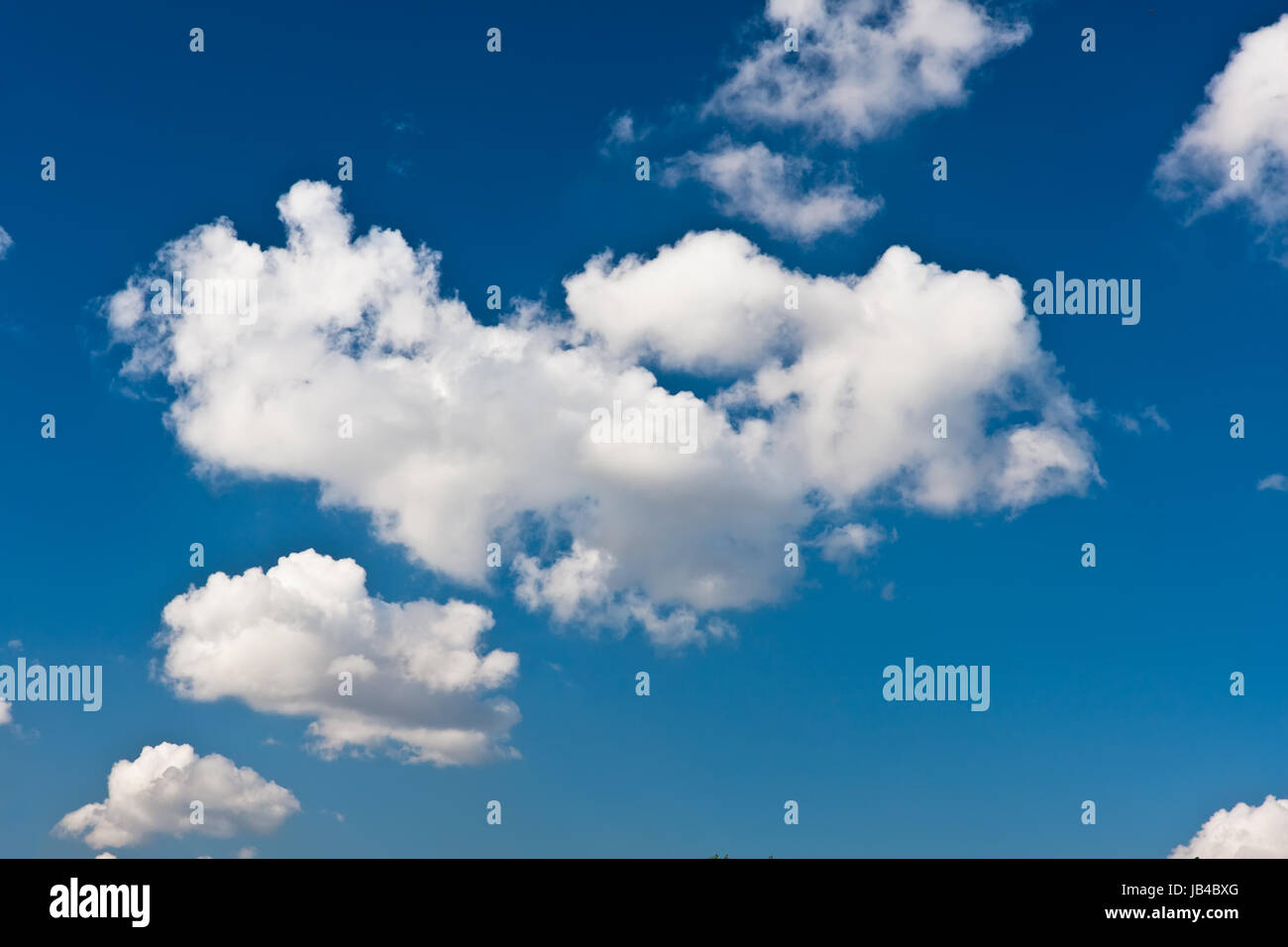 White clouds in blue summer sky background Stock Photo - Alamy
