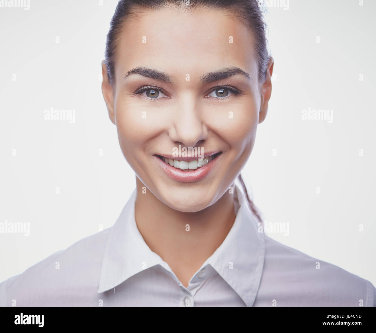 Young businesswoman looking at camera with toothy smile Stock Photo - Alamy