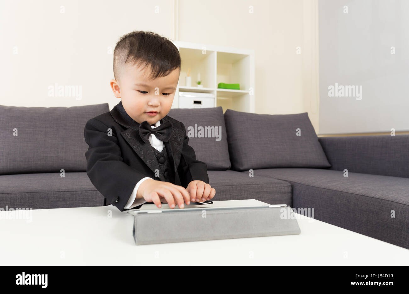Little boy using tablet Stock Photo - Alamy