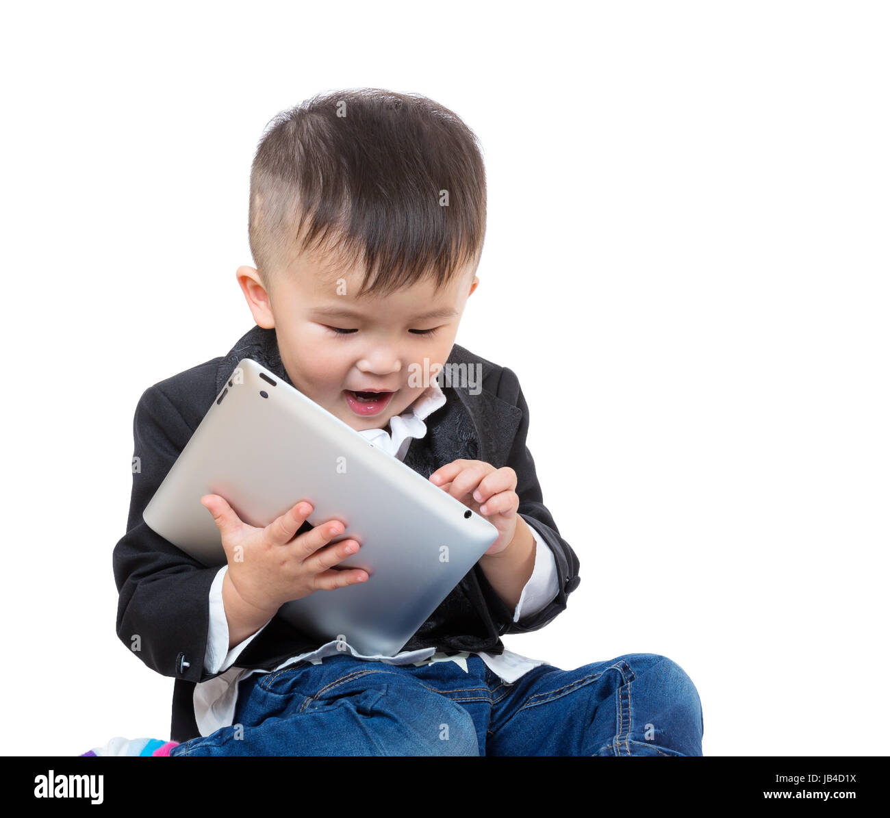 Little boy using tablet Stock Photo - Alamy