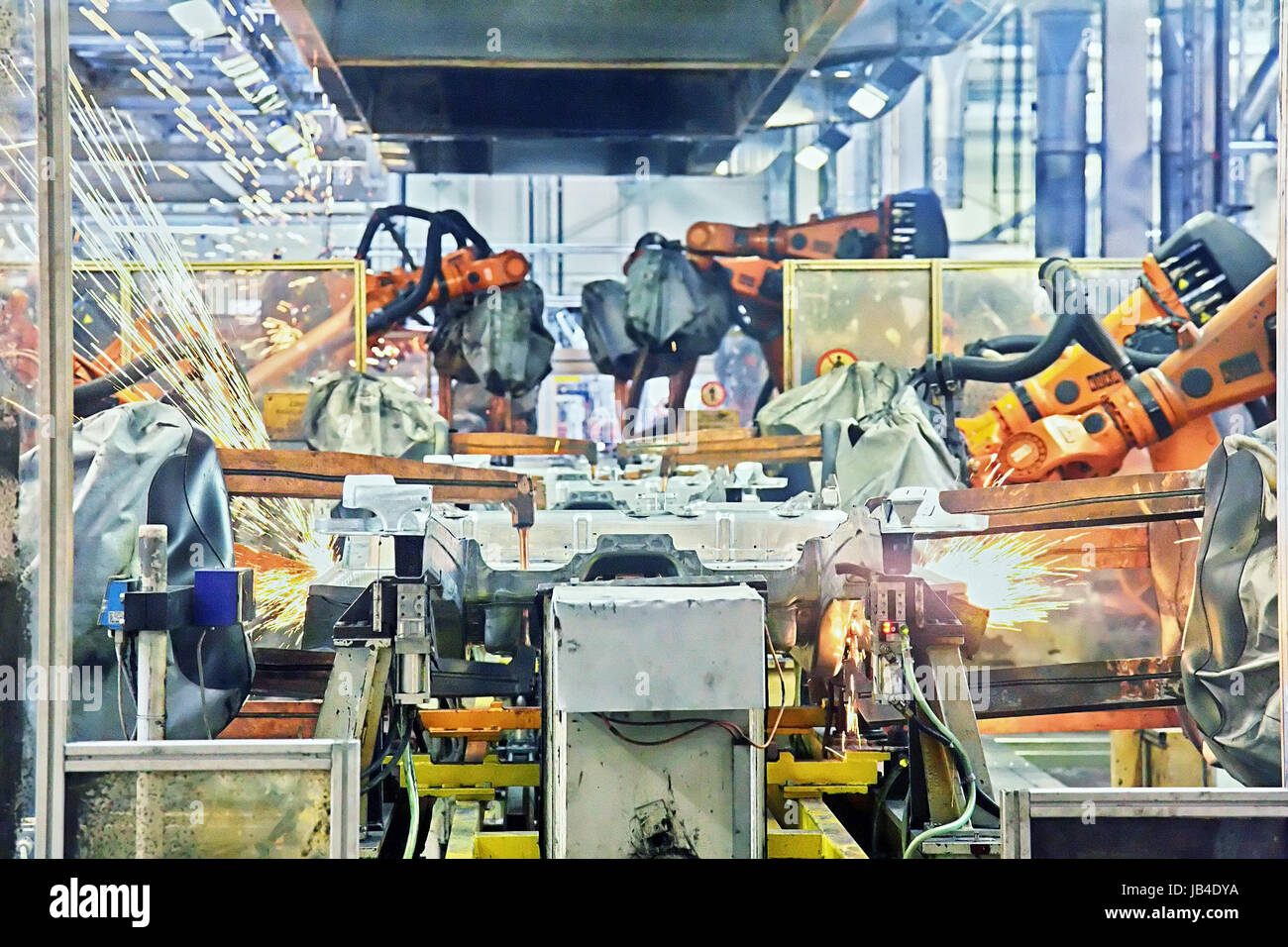 robots welding in a car factory Stock Photo