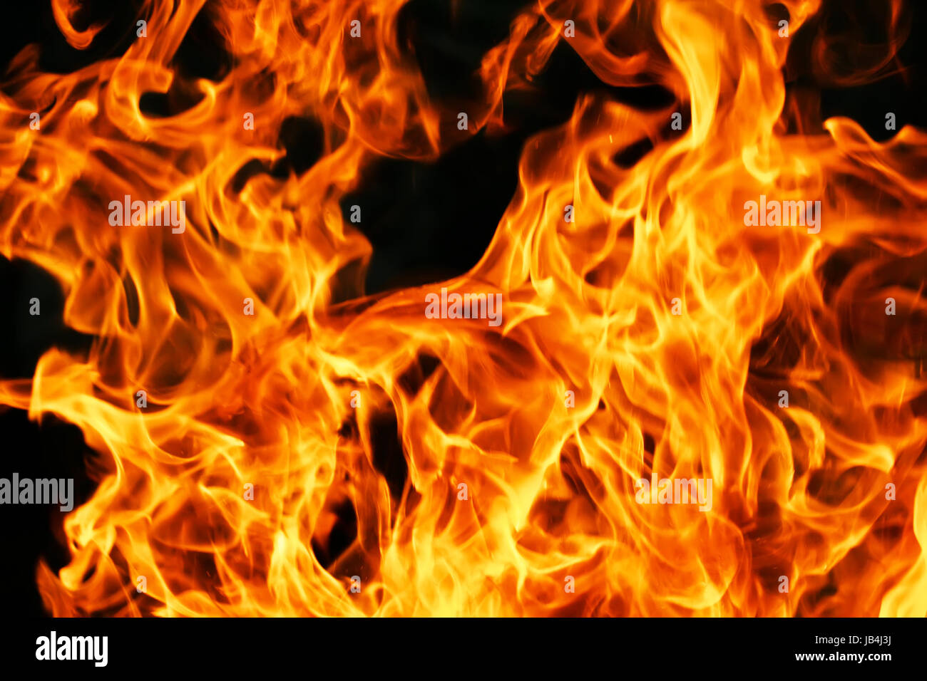 Beautiful yellow and orange hot fire on black background Stock Photo ...
