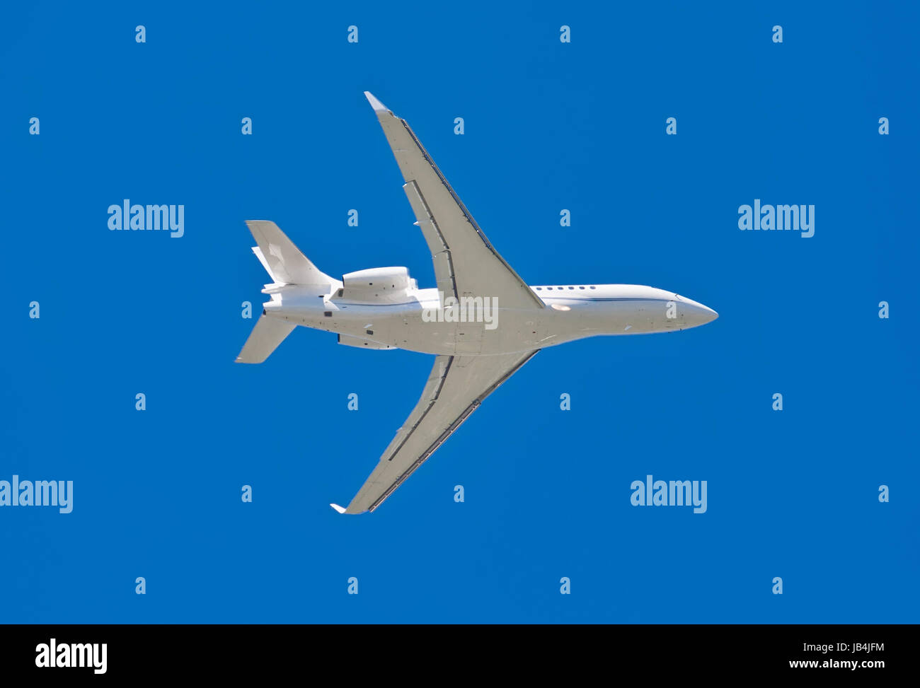 Beautiful white passenger airplane in blue sky Stock Photo - Alamy
