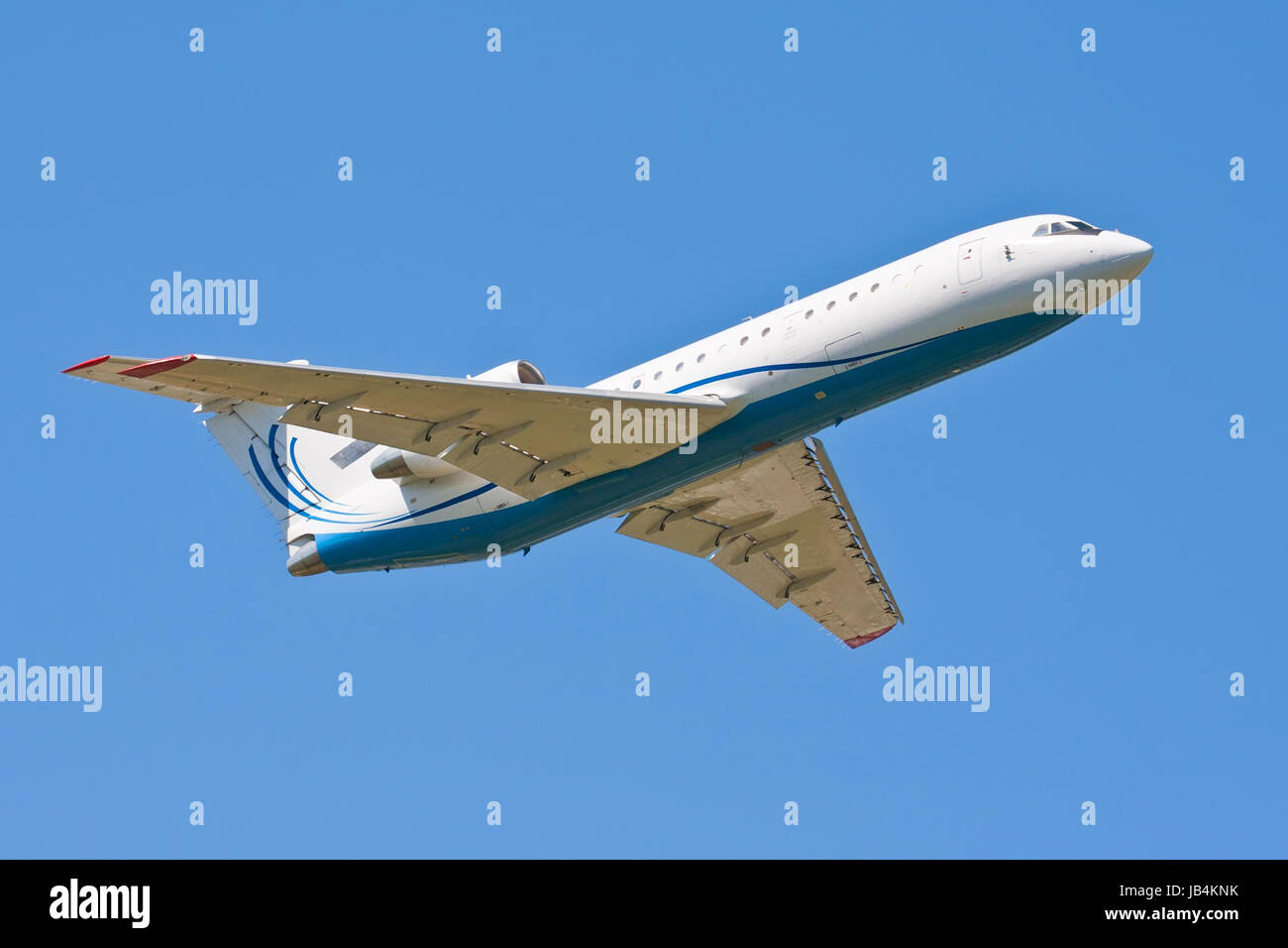 Beautiful white passenger airplane in blue sky Stock Photo - Alamy