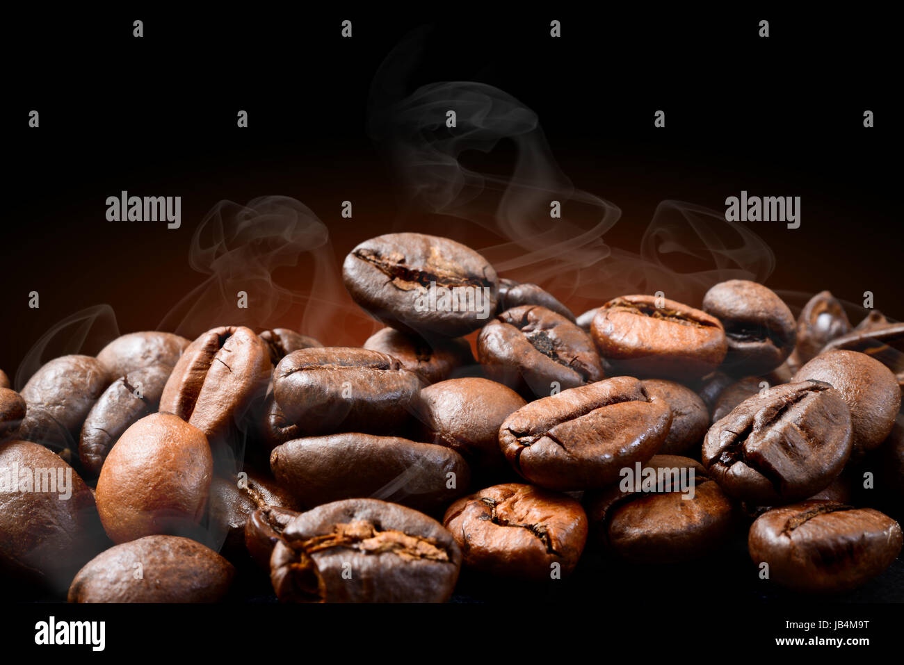 coffee beans who smoke during roasting. Stock Photo