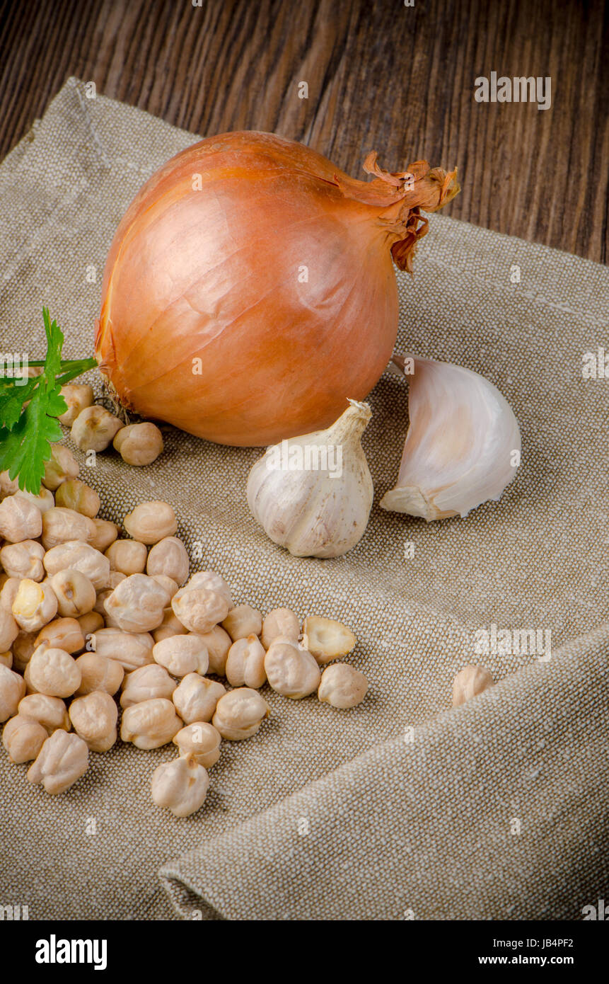 Closeup detail of Garlic and onion on a textile napkin Stock Photo - Alamy