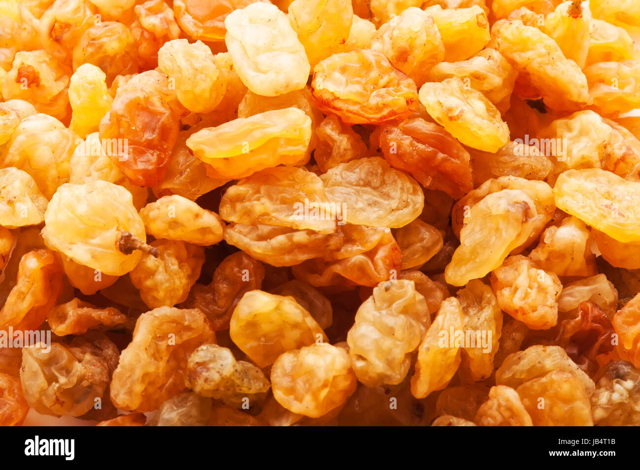 Heap of raisins golden dried grapes background Stock Photo Alamy