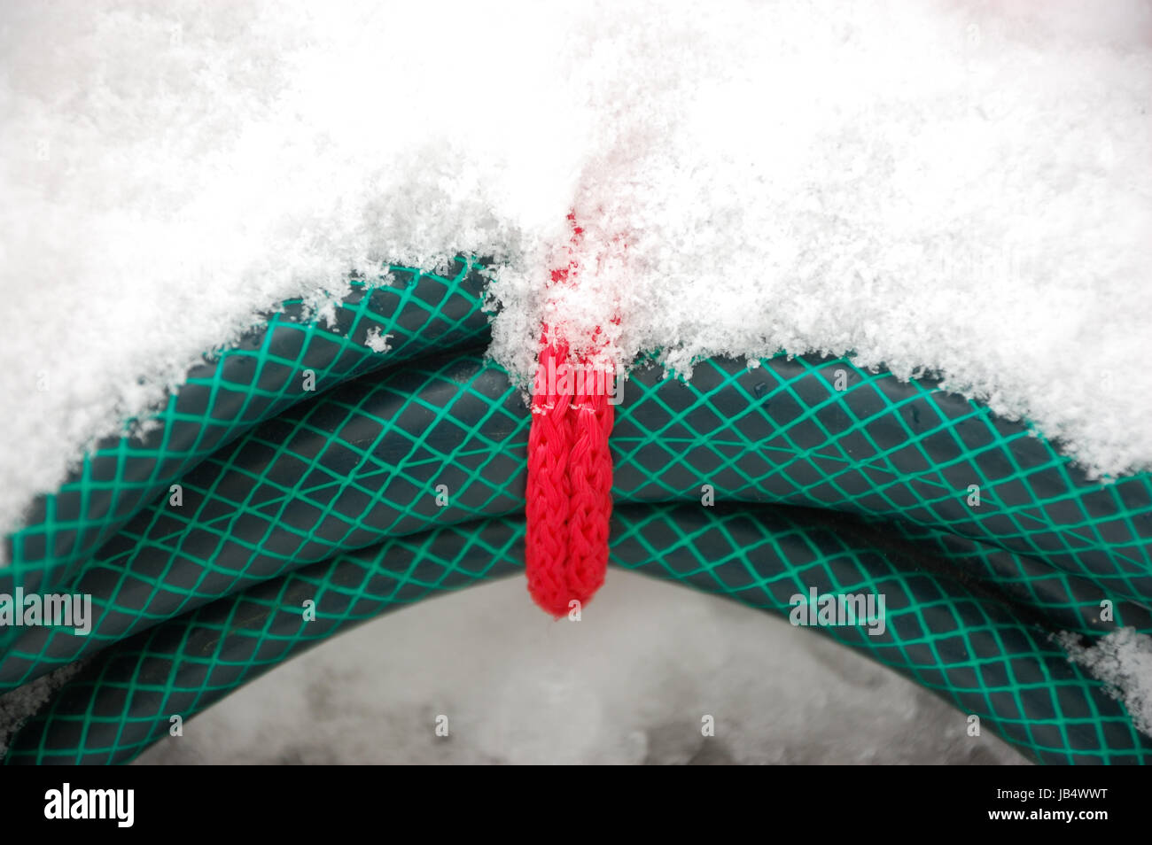 Garden hose in winter Stock Photo Alamy