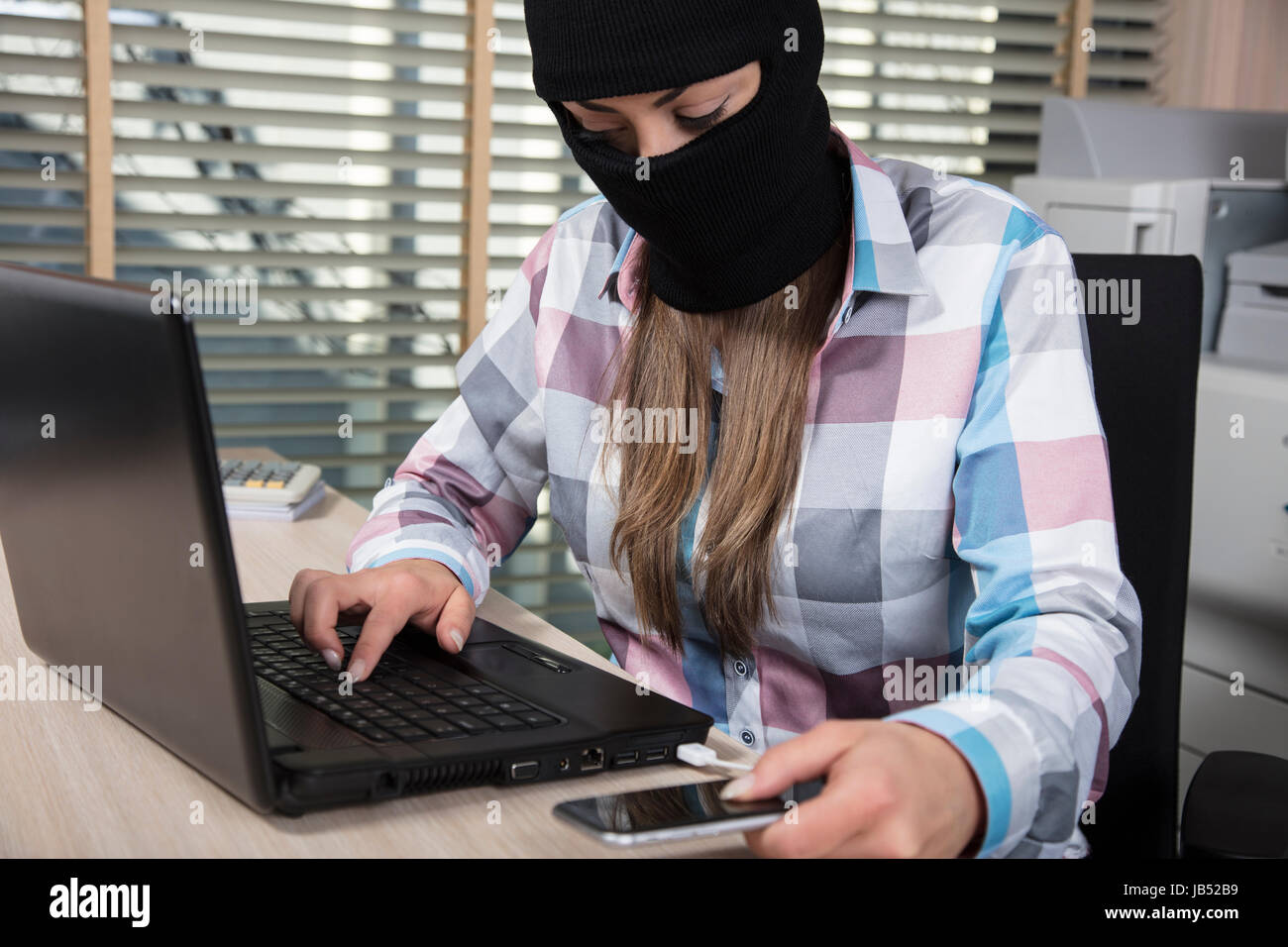 hacker attacks from phone and computer Stock Photo
