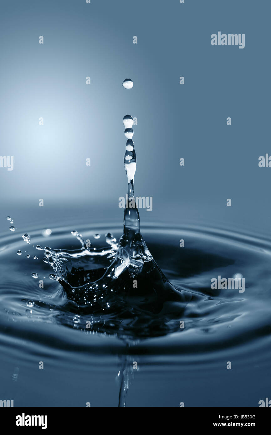 Nice abstract blue water splash on gradient background Stock Photo