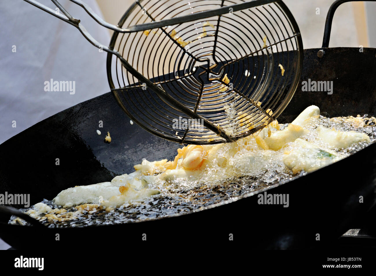 frying vegetables with oil in the pan Stock Photo Alamy