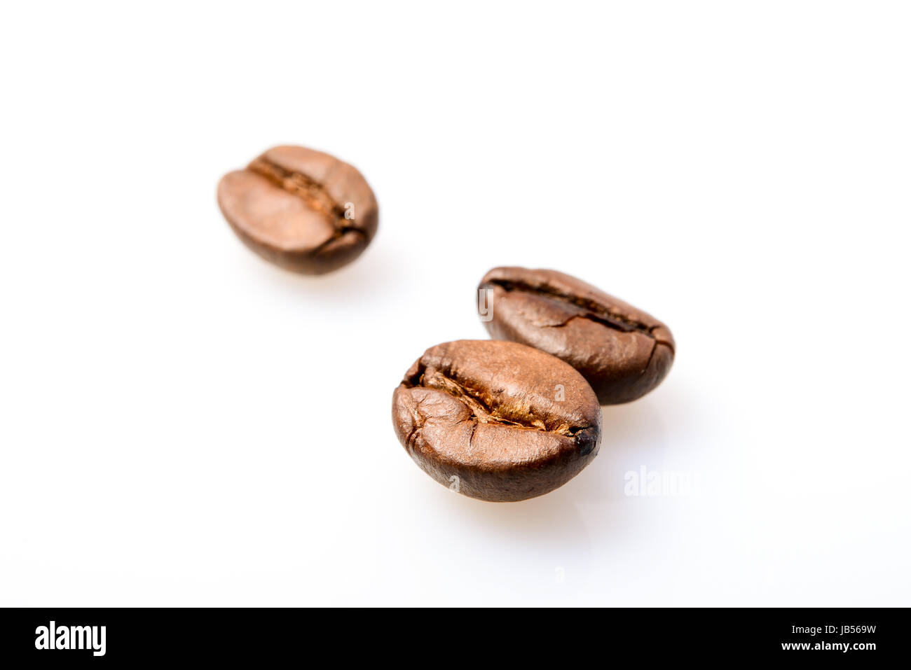 Macro photografy of coffee beans isolated on a white background Stock Photo