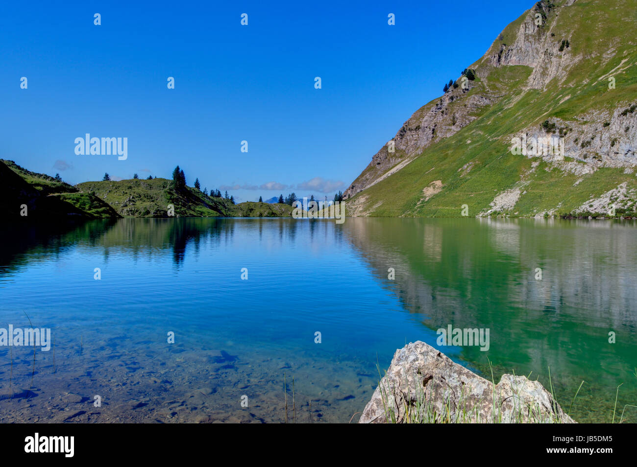 mountain lake with reflection Stock Photo