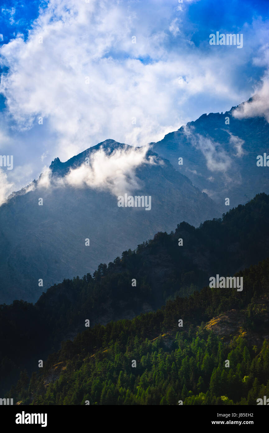 Morning in mountains with fog and clouds during sunrise Stock Photo - Alamy