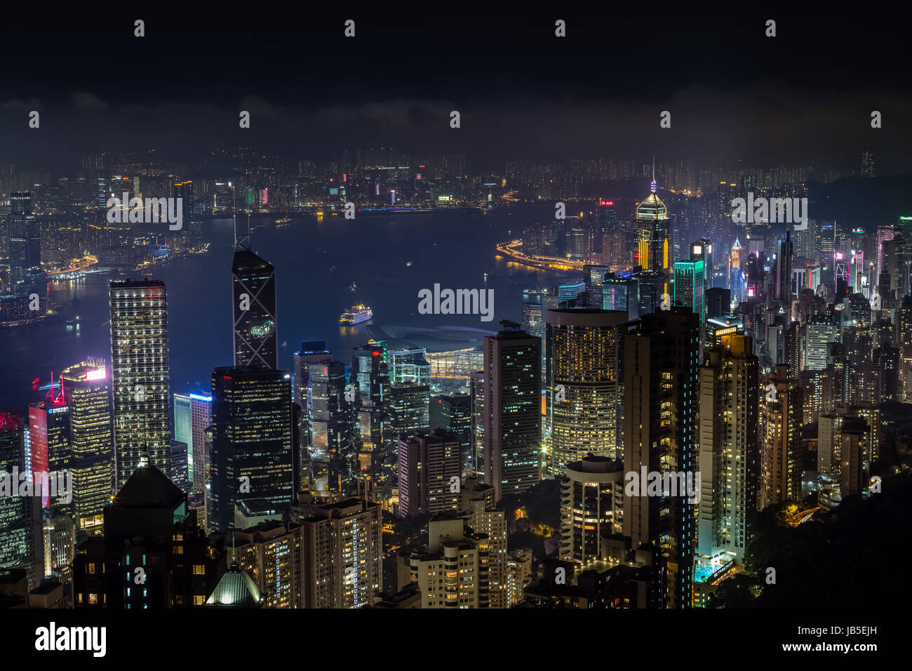 Aerial night view from Victoria peak to Kowloon bay and skyscrapers of
