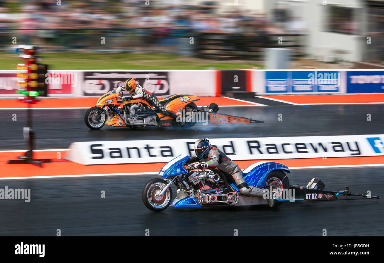 Super Twin drag racing at Santa Pod Raceway. Roman Sixta Nitro V60 nearside V Ronny Aasen Zodiac Harley far side. Stock Photo