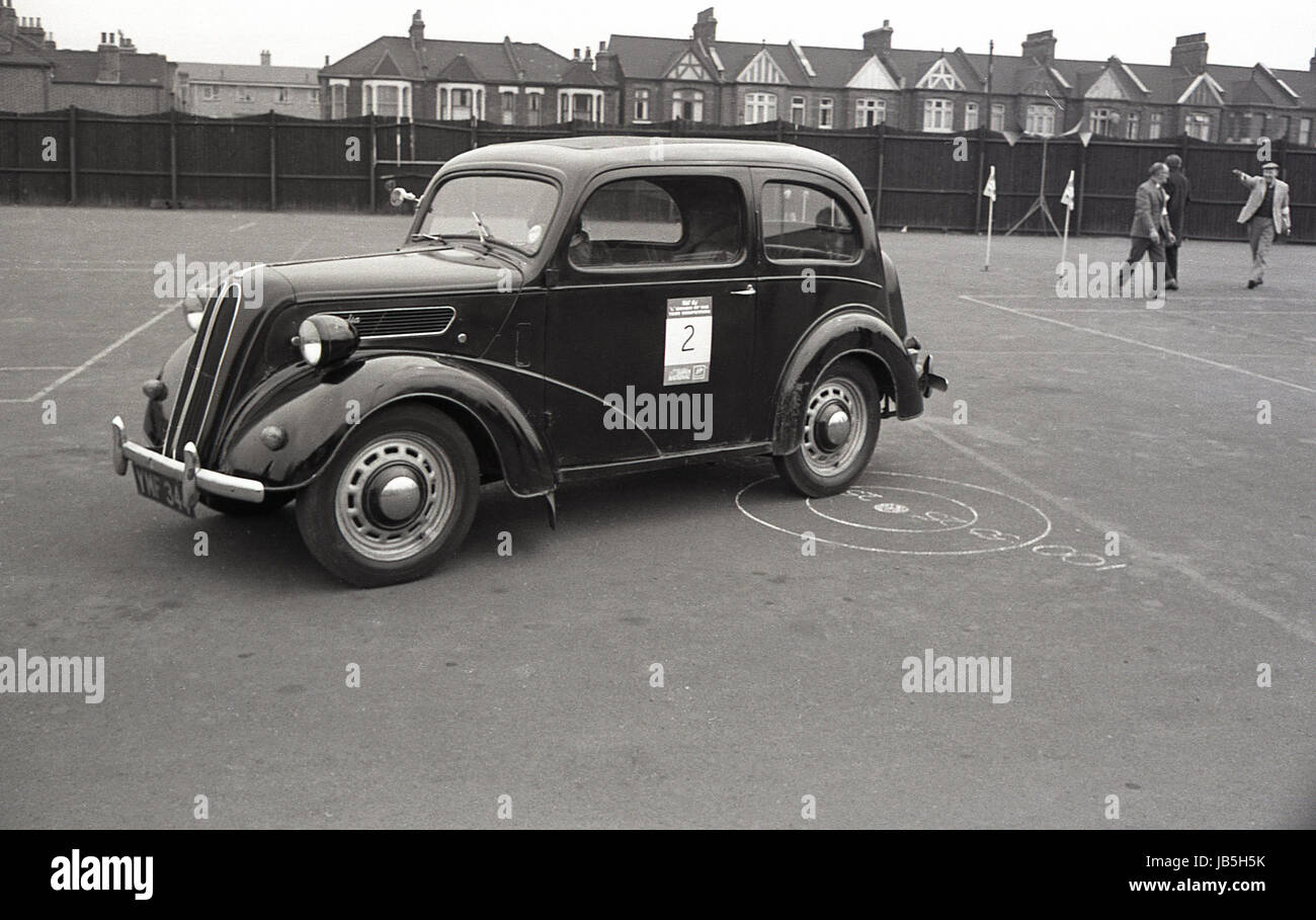 1960s, historical, a Ford Anglia 100E taking part in the Learner Driver of the Year Competition held in the car park of the Catford Greyhound Stadium, Catford, South London, SE6, England, UK. Stock Photo