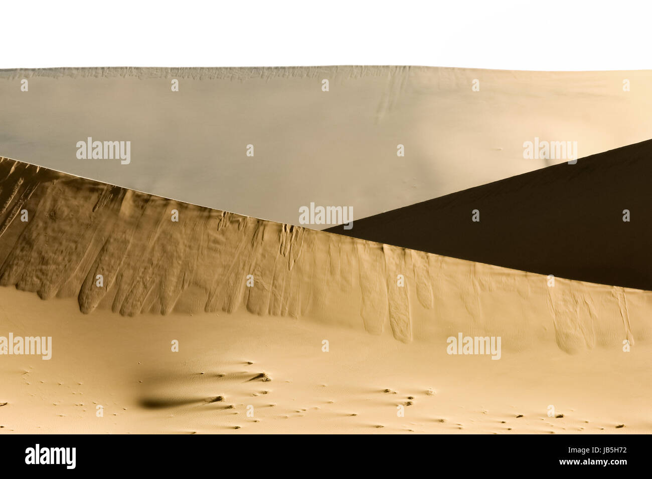 Big sand dune contrasts. Desert or beach sand textured background. Stock Photo