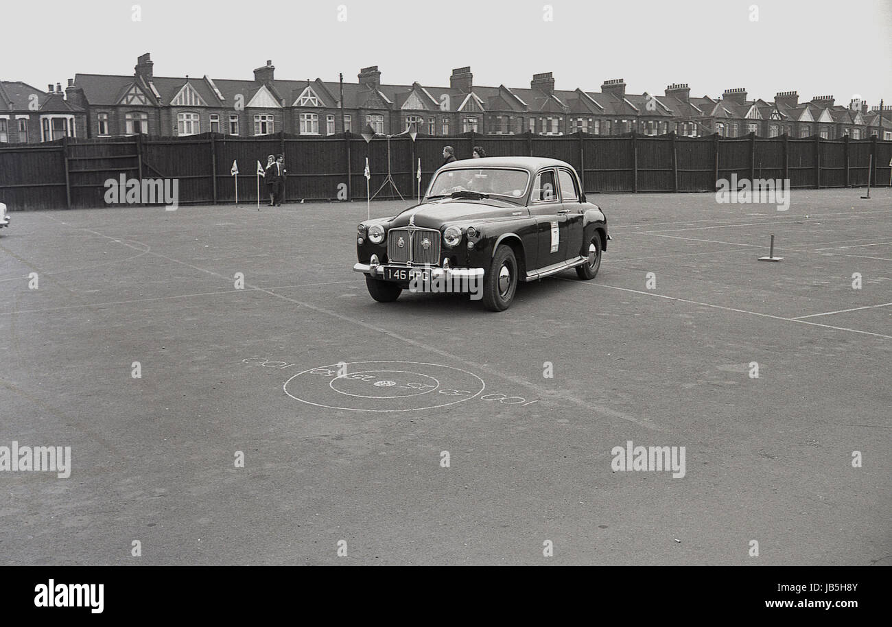 1960s, historical, picture shows a Rover P4 motor car negotiating flagposts in the car park at the Catford Greyhound Stadium, Lewisham, London, SE6 in the Learner Driver of the Year contest. Stock Photo