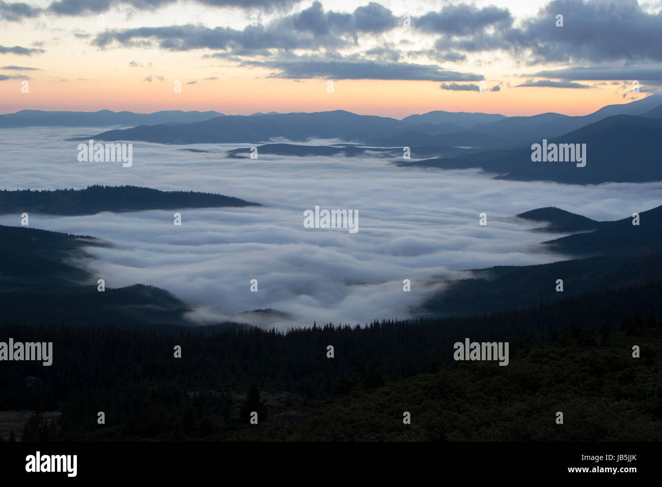 Sunrise in the mountains above the clouds Stock Photo - Alamy